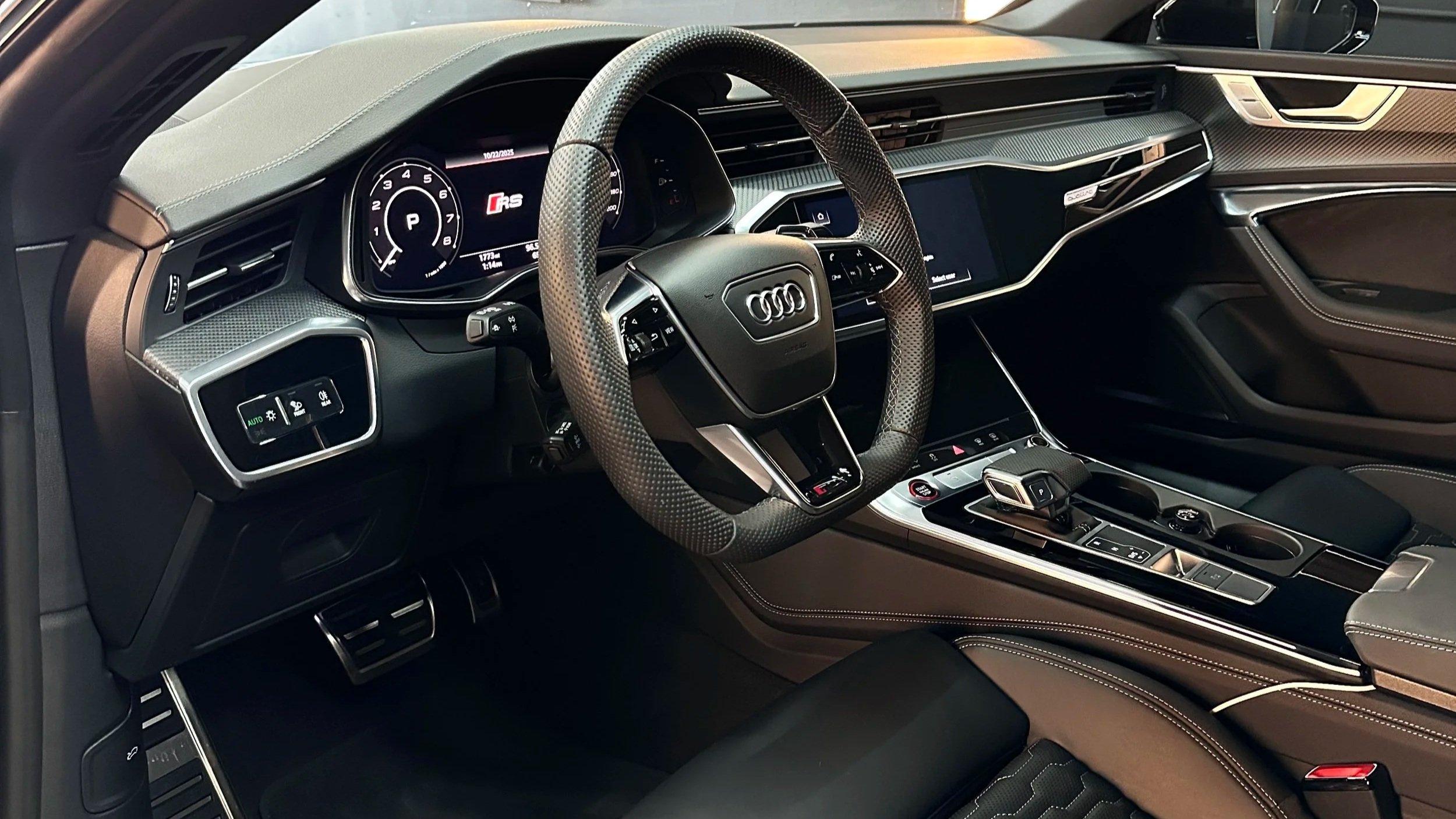 Freshly detailed Audi RS interior with clean leather steering wheel, dashboard and seats